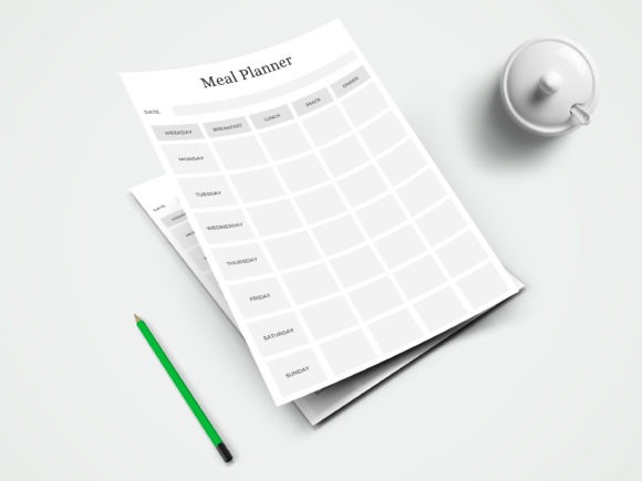 weekly meal planner template with days and meal sections on white paper beside green pencil and white cup