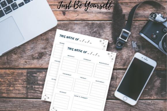 printable weekly planner template with days of the week and notes section on wooden desk with laptop, phone, and camera