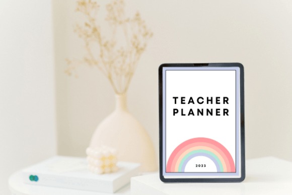 Teacher planner templates displayed on a tablet with a rainbow design and 2023 year